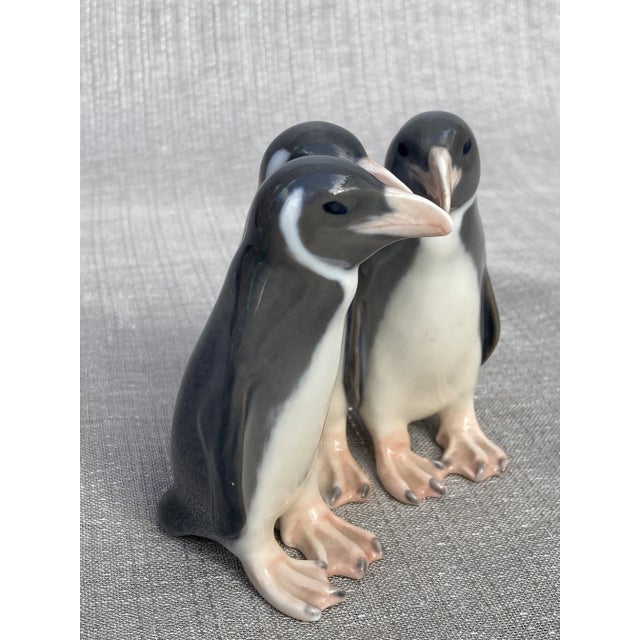 Sweet vintage porcelain penguin trio figurine. Royal Copenhagen, signed and numbered. They measure 3 7/8" by 3 1/4" by 3...