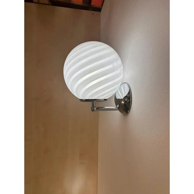 Luxury modern milky-white sphere in murano glass working with “rigadin ritorto ” tecnique. design in very particular and...