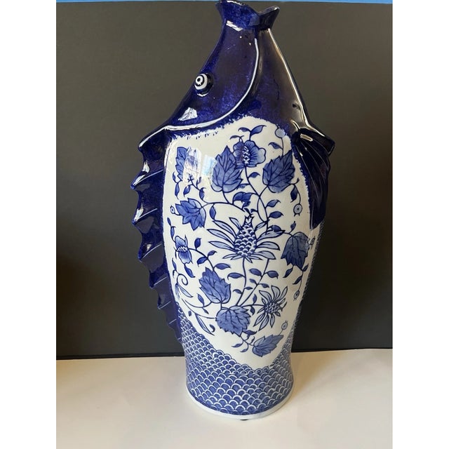 Add an elegant touch of traditional Asian artistry to your home with this **Vintage Chinese Hand-Painted Porcelain Fish...