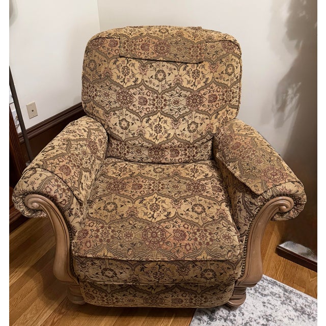 Super comfortable tapestry recliner. In great condition for a previously owned chair. Accented with light colored wood and...
