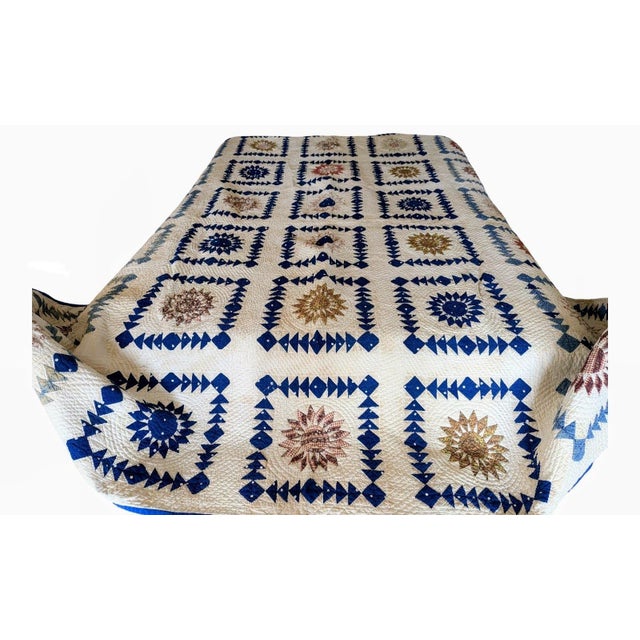 The pattern of this quilt closely resembles that classic Mariner's Compass design popular in the 1840s-1850s. The arms of...