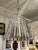 Design Plus Gallery presents a Rustic Industrial Lattice Drum Chandelier. This chandelier has a wide tapered drum shade...