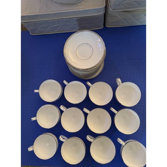 Gorgeous new fine china, white with platinum rim. Beautiful neutral color makes it easy to add any color linens to the...