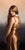 Twilight by Beth Sistrunk | Oil on panel Portrait of a woman in a golden dress with a serene expression. For Sale