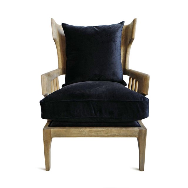 Solid carved oak wood wingback frame chair with rich deep indigo/navy upholstered poly down fill cushions. Seat height is...