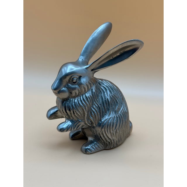 Charming vintage silver-tone rabbit sculpture featuring wonderfully expressive details, dramatically elongated ears, and...