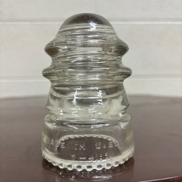 This is a gorgeous antique clear glass Hemingray No. 12 insulator embossed “HEMINGRAY – No. 12 – U.S.A.”. Produced by the...