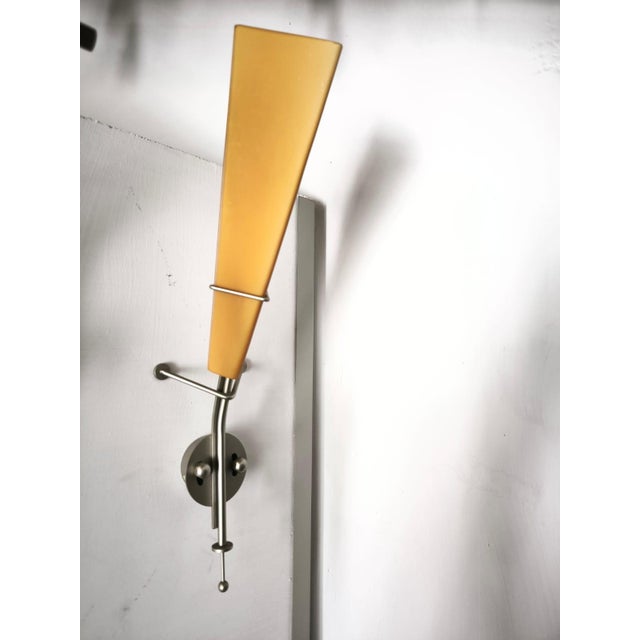 Wall Light by Lamp International, 1990s, in Very Good conditions. Designed 1990 to 1999 This piece has an attribution...