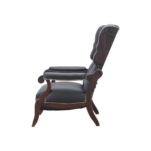 Black Leather Armchair ENGLAND, 19TH CENTURY $2,500.00 Beautiful reading chair, reupholstered in real black leather....