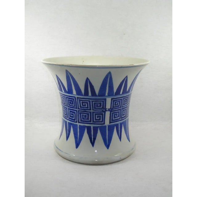 Up for sale is an unusual large Chinese blue and white porcelain vase or brush pot decorated with archaic fret and leap-...