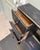 A small secretary desk dating from the early 20th century, remarkable for its narrow dimensions and superb black patina,...