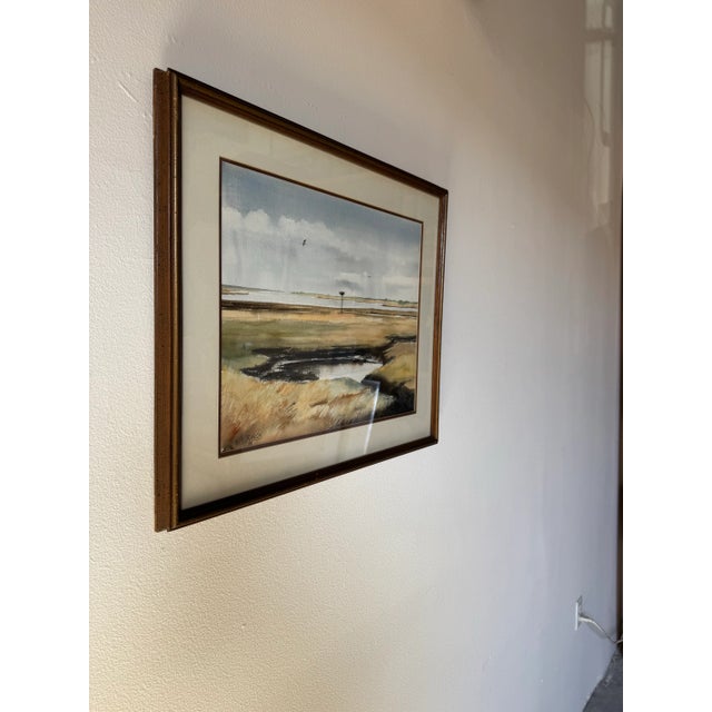 This 1980s watercolor painting by B. Mills captures the serene beauty of Florida’s natural landscape. Soft, vivid tones...