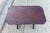 This Spanish style accent table showcases a rich, dark reddish-brown color, characteristic of mahogany wood. The table...