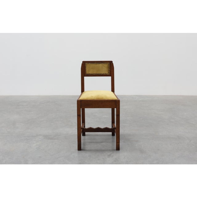 This Belgian Art Deco side chair, dating from the 1920s, captures the bold geometric spirit that defined the era's...