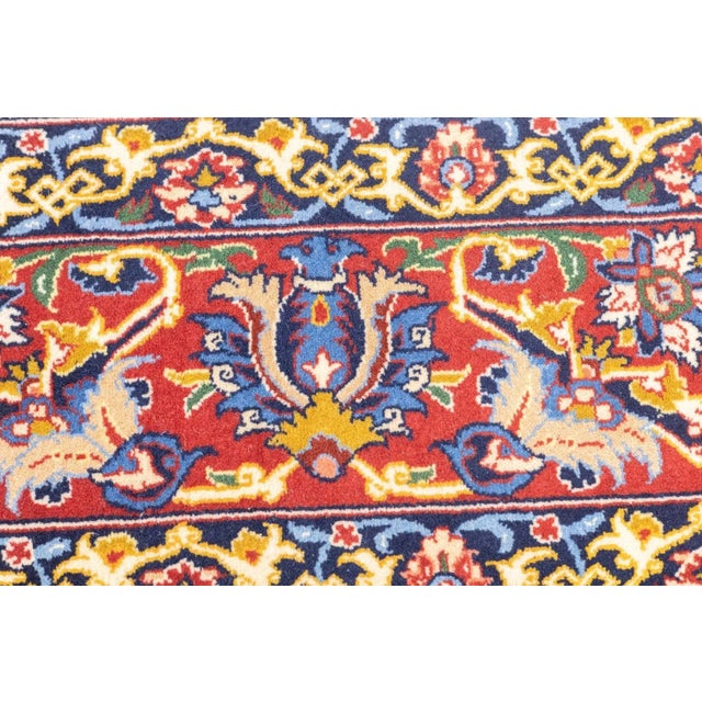 The ivory field shows a tightly drawn directional pattern of palmettes, leaves and vinery in a multitude of secondary...