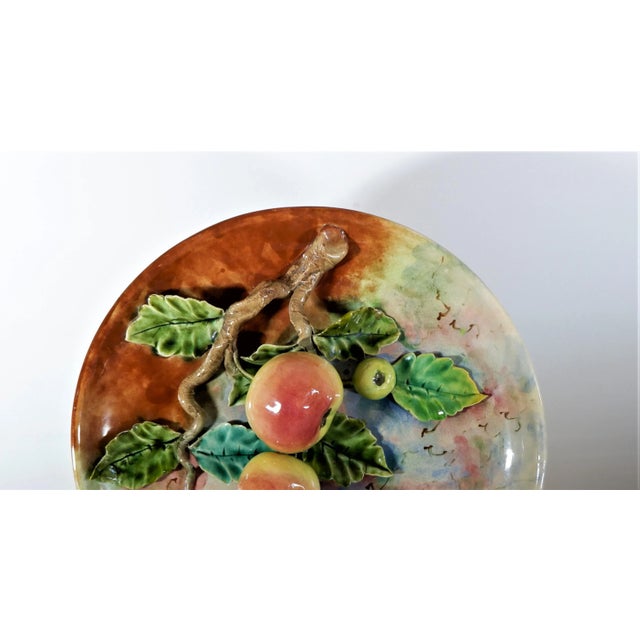 An antique Majolica French Barbotine Palissy fruit plate. Circa 1890. Measures approx. 13” diameter and 3 ½” thick. Good...