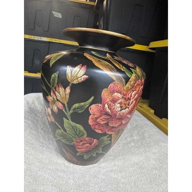This Floral Vase is a charming miniature bottle-shaped vase with black and gold accents, perfect for home decor or a...