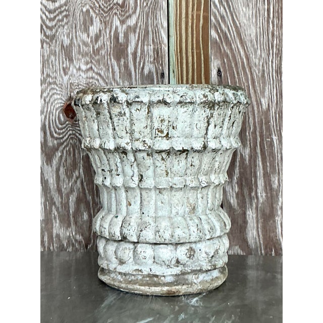 Infuse your space with timeless architectural character with this vintage cast stone planter. Crafted with a substantial,...