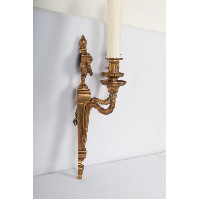 A fine patinated bronze two light sconce, waxed sleeves, ready for direct mount.