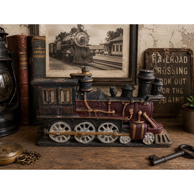 Bring classic Americana railroad charm into your space with this vintage cast iron steam locomotive doorstop, featuring...