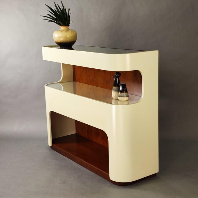 Vintage white curved wooden console table from the 1970s. White lacquered wooden frame with a mirror on the top and a...