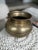 The handcrafted origin of this little pot gives way to its little tilt. Perfect as a modern day accent piece or planter.