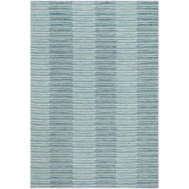Transform your outdoor space into a coastal retreat with the Patio Plus area rug, a delightful blend of tradition and...