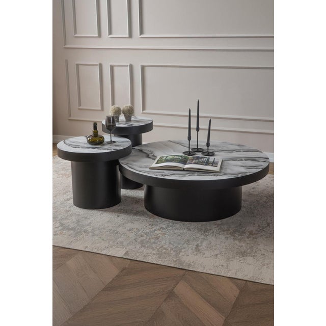 Add a touch of modern elegance to your living space with our Trio Coffee Table Set! Featuring a stylish faux marble top,...