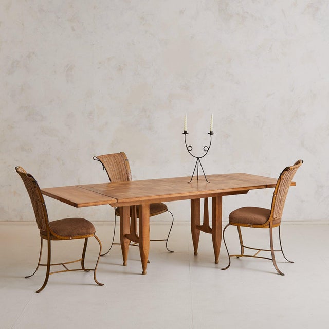 An ode to material integrity and purposeful design, this extendable dining table by Guillerme et Chambron distills the...