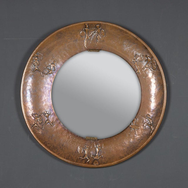 Striking mid 20th Century large circular brutalist mirror from the 1970s with a wide bronzed copper frame depicting...