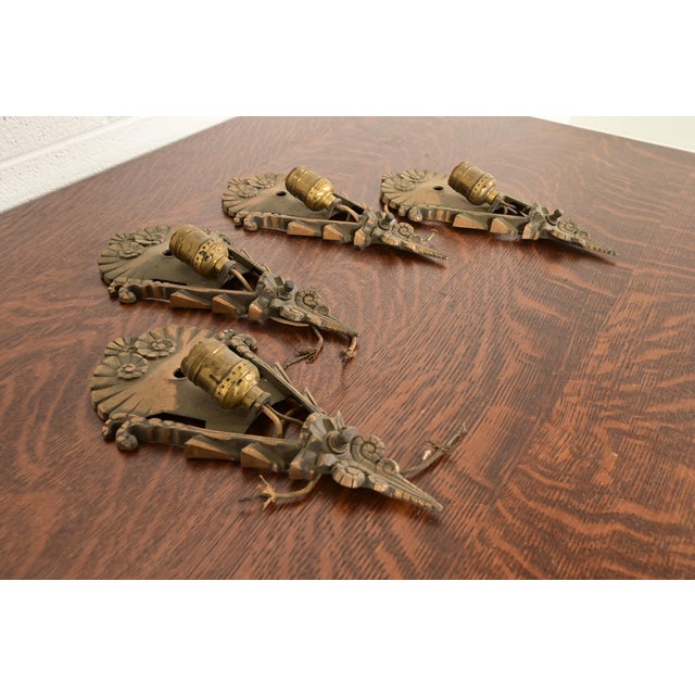 A gorgeous set of four Art Deco period bronze wall sconces In the manner of Tiffany Studios By Mid-West Manufacturing Co....