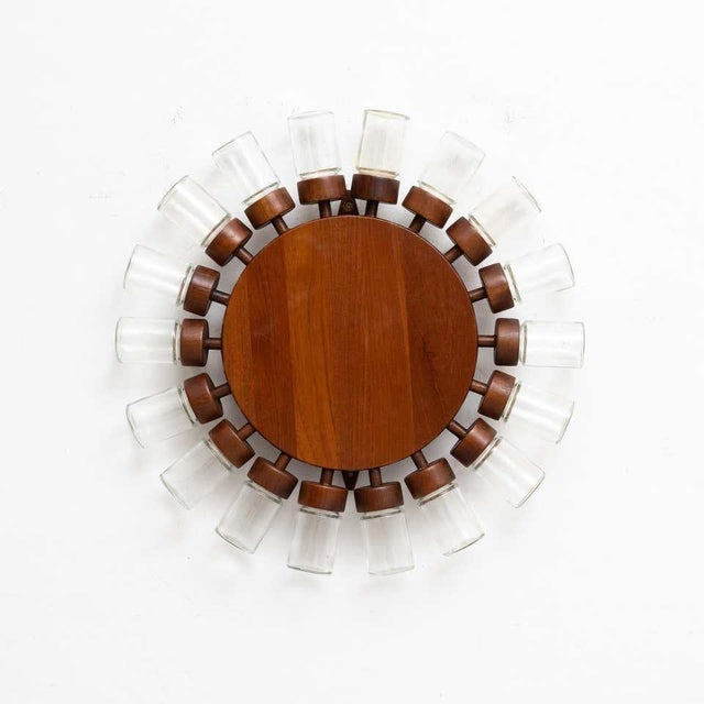 Vintage spicery consisting in 18 glass pots in a round shaped rotatory wooden display. Made by unknown manufacturer, in...