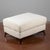 This pouf is an example of modern furniture design, characterized by clean lines and generous volumes. Upholstered in a...
