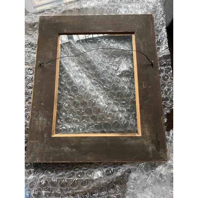 Antique or vintage gold frame with carved detailing on edges. Shows beautiful patina from age. Includes a piece of glass....
