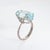 Stylish aquamarine & diamond cocktail ring crafted in 18k white gold. Faceted oval cut aquamarine measures 17.5mm x 9mm...