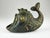 The large ashtray has a green patina and measures 11 cm wide, 8.5 cm high, and 6.5 cm deep. The smaller, black patina...