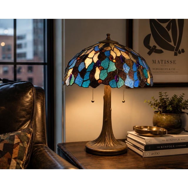 Vintage Tiffany Style Double-Light Art Glass Table Lamp With Sculpted Bronze-Tone Base A richly detailed Tiffany-style art...
