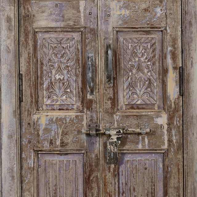 Armoire constructed from antique Indian painted teakwood doors and architectural elements, showcasing the depth, patina,...