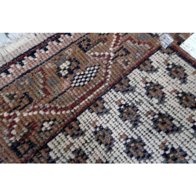 Handmade vintage Indian Seraband rug in white color and all-over design. The rug has been made in the end of 20th century....