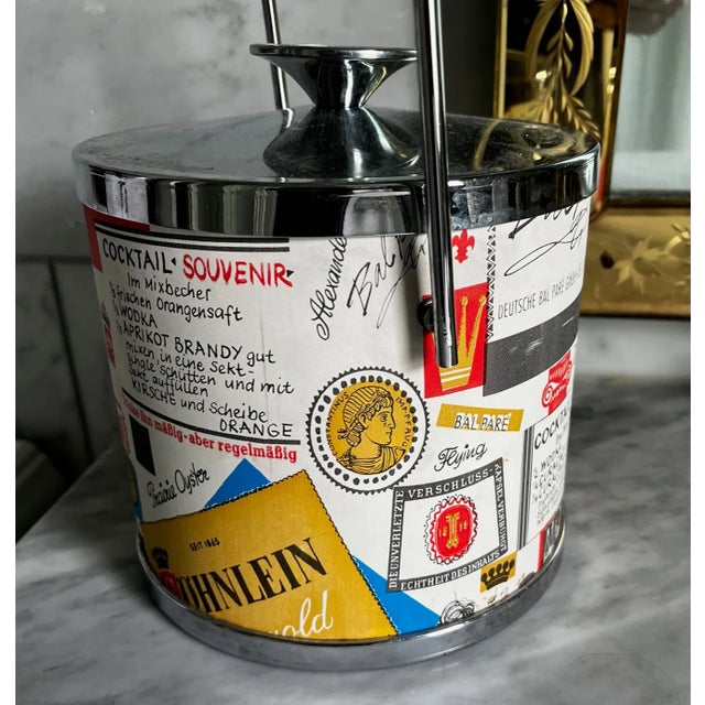 Cute ice bucket with great colors and German written cocktail recipes. A great addition to your bar!