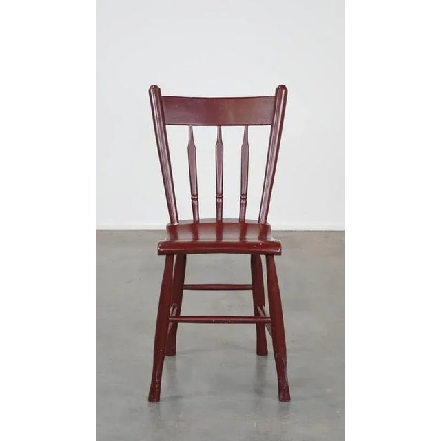 Vintage Dutch farmhouse dining room/side chair made of burgundy red colored wood. This nice wooden chair radiates a nice...