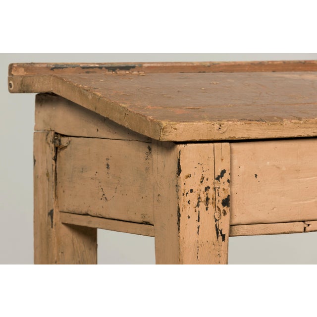 A late 19th century French school desk with integrated bench, sourced in Provence, France. Constructed entirely as one...