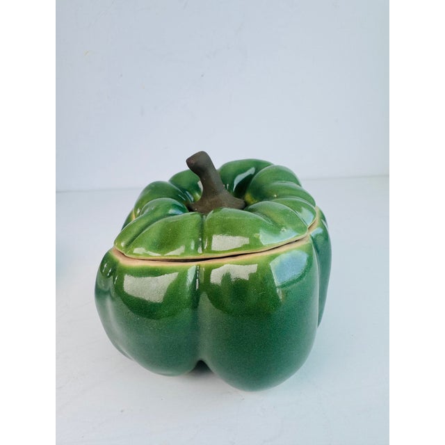 Offering a handmade lidded jar disguised as a pepper by artist Patricia Garrett. Add this to your collection of her...