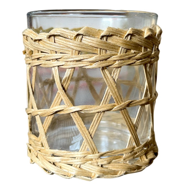A charming set of two wicker-wrapped glass votive holders, perfect for adding warm, organic texture to any space. Each...