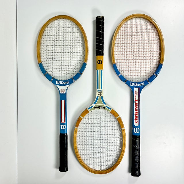 This is a set of 3 Vintage Wilson Wood Tennis Rackets from the 1950-1970s. The green racket is the oldest and has chippy...