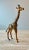 Beautiful Sculpted Leather Giraffe Sculpture. Great decorative addition for a bookshelf.