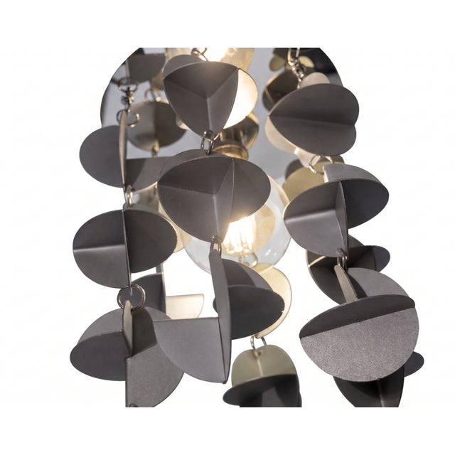 The concept: mechanical geometry under the microscope blades is a piece of conceptual lighting design that redefines...