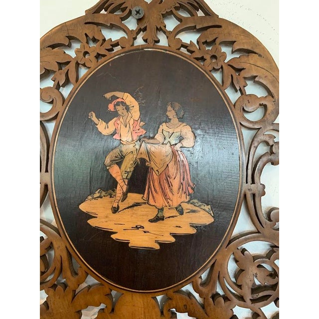 Pair of marquetry shelves from sorrente, italy openwork carving central medallions decorated with a dancing couple and a...