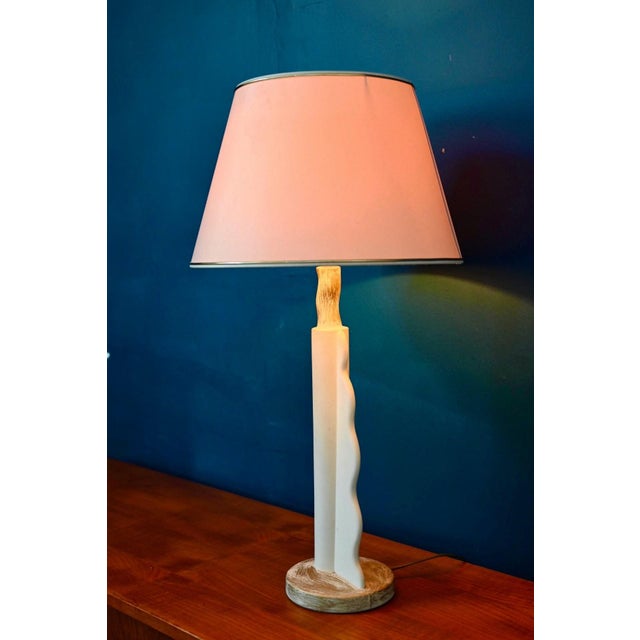 This is a lamp unlike any other. Its sculptural, organic white plaster base creates an almost lifelike silhouette: a...