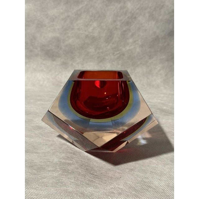 A massive, geometric Murano ashtray crafted using the iconic “vetro sommerso” technique associated with Flavio Poli and...